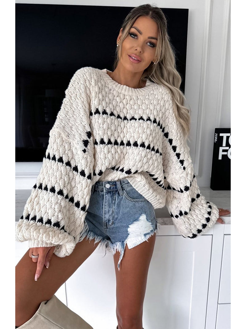 Model wears cream chunky knit jumper with balloon sleeves front view 